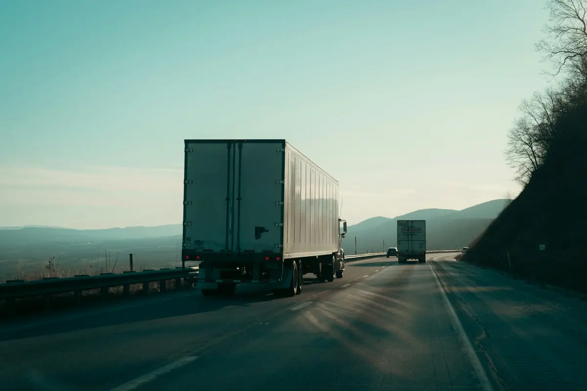 Cargo truck on an open highway at dusk